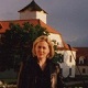 Mistress Troy on balcony of the Long House at OWK