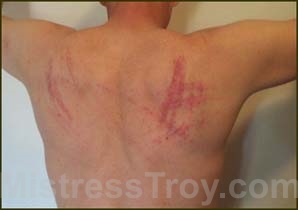 MISTRESS TROY Professional Dominatrix NYC New York City visited the OWK to enjoy submissive male slaves, other fem dommes, fetish
		 	attire, slave auction, whipped ass contest, female domination and protocol training